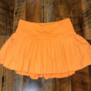 Goldhinge Pleated Athletic Orange Skirt